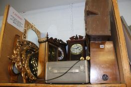 Mirrors, wall clocks and a radio
