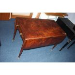 A 19th century mahogany drop flap table, with two drawers