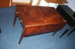 A 19th century mahogany drop flap table, with two drawers