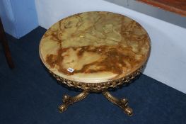 A brass and onyx circular table