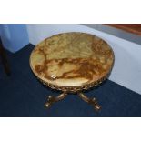 A brass and onyx circular table