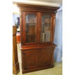 A reproduction mahogany Victorian style bookcase