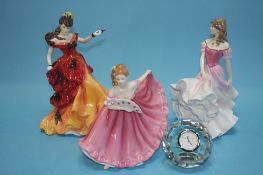 Eight Royal Doulton figures and a glass clock