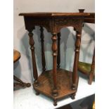 Carved oak two tier occasional table