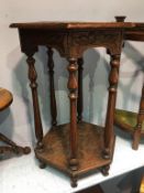 Carved oak two tier occasional table