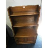 A small Ercol oak bookcase, 53cm wide