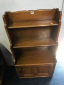 A small Ercol oak bookcase, 53cm wide