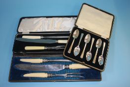 Two carving sets and a set of grapefruit spoons