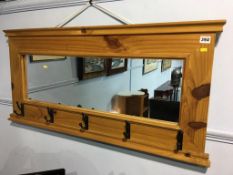 A pine and mirror back coat rack, 102cm wide