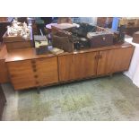 An IB Kofod-Larsen for G-Plan long teak sideboard, circa 1960s, with two cupboard doors and five