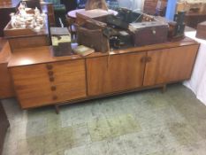 An IB Kofod-Larsen for G-Plan long teak sideboard, circa 1960s, with two cupboard doors and five