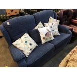 A blue two seater settee