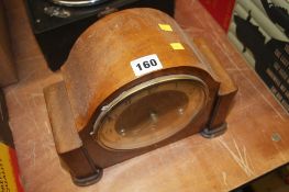 An Art Deco walnut mantle clock