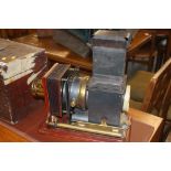 A Magic Lantern with case, various Thornton Pickard lenses and a collection of glass slides,