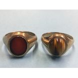 A Gents 9ct gold Tiger's eye and a 9ct signet ring. Total weight 12.1 grams