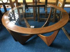 A G Plan teak circular coffee table, with inset glass top