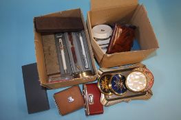 Two boxes of compacts, Parker Pens, lighters etc.