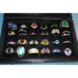 A case of twenty six decorative rings