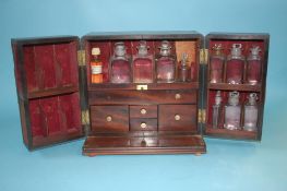 A 19th century mahogany Campaign style Apothecary travelling cabinet, with fitted drawers and