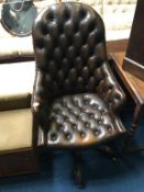 A brown Chesterfield high back office swivel chair