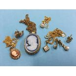 An 18ct gold and diamond pendant, two 9ct gold cameo pendants and a seed pearl pendant with
