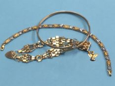 A 9ct gold bi-colour bracelet, a 9ct gold padlock bracelet and bangle etc. Weight 16.5 grams