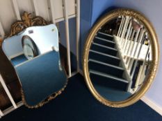 Gilt oval mirror and another mirror