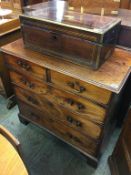 A Georgian mahogany straight front chest of drawers, with two short and three long graduated