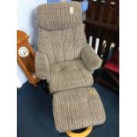 A recliner armchair and foot stool