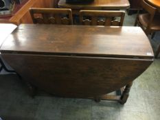 An oak gateleg table