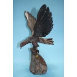 A carved wooden Eagle on stand and a carved wood Wolf's head (2)