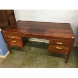 A rosewood desk with five drawers to the front, supported on turned legs, 152cm wide x 75cm deep