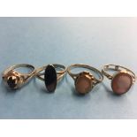 Four 9ct gold dress rings. Total weight 7 grams