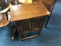 A small oak two door cabinet, 51cm wide