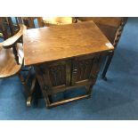 A small oak two door cabinet, 51cm wide