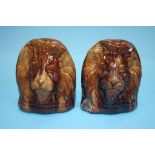 A pair of 19th century treacle glazed pottery Sash window rests, formed as Lion heads (2)
