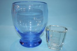 A blue glass vase and a clear glass vase