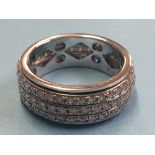 A Brooks and Bentley 9ct white gold ring, set with three rows of diamonds. Total weight 7.9 grams