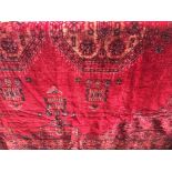 A red patterned Chenille table cloth