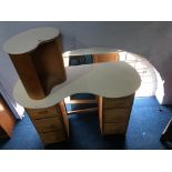 A kidney shaped dressing table, mirror and stool