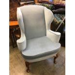 A large Queen Anne style Wing armchair, with walnut cabriole legs