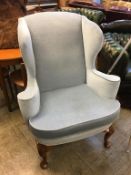 A large Queen Anne style Wing armchair, with walnut cabriole legs