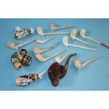 A collection of porcelain pipes and clay pipes