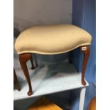 A cabriole leg stool