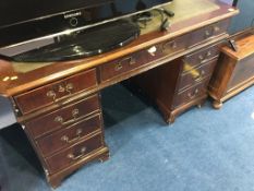 A reproduction mahogany pedestal desk and filing drawers (2)
