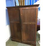 An oak two door fitted wardrobe, 130cm wide x 170cm high