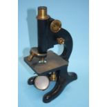 A model 29 Beck microscope, case and a quantity of glass slides