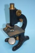 A model 29 Beck microscope, case and a quantity of glass slides