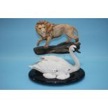 A Beswick model of a lion and a Franklin Mint group 'Under Her Wing' (2)