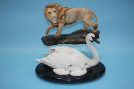 A Beswick model of a lion and a Franklin Mint group 'Under Her Wing' (2)